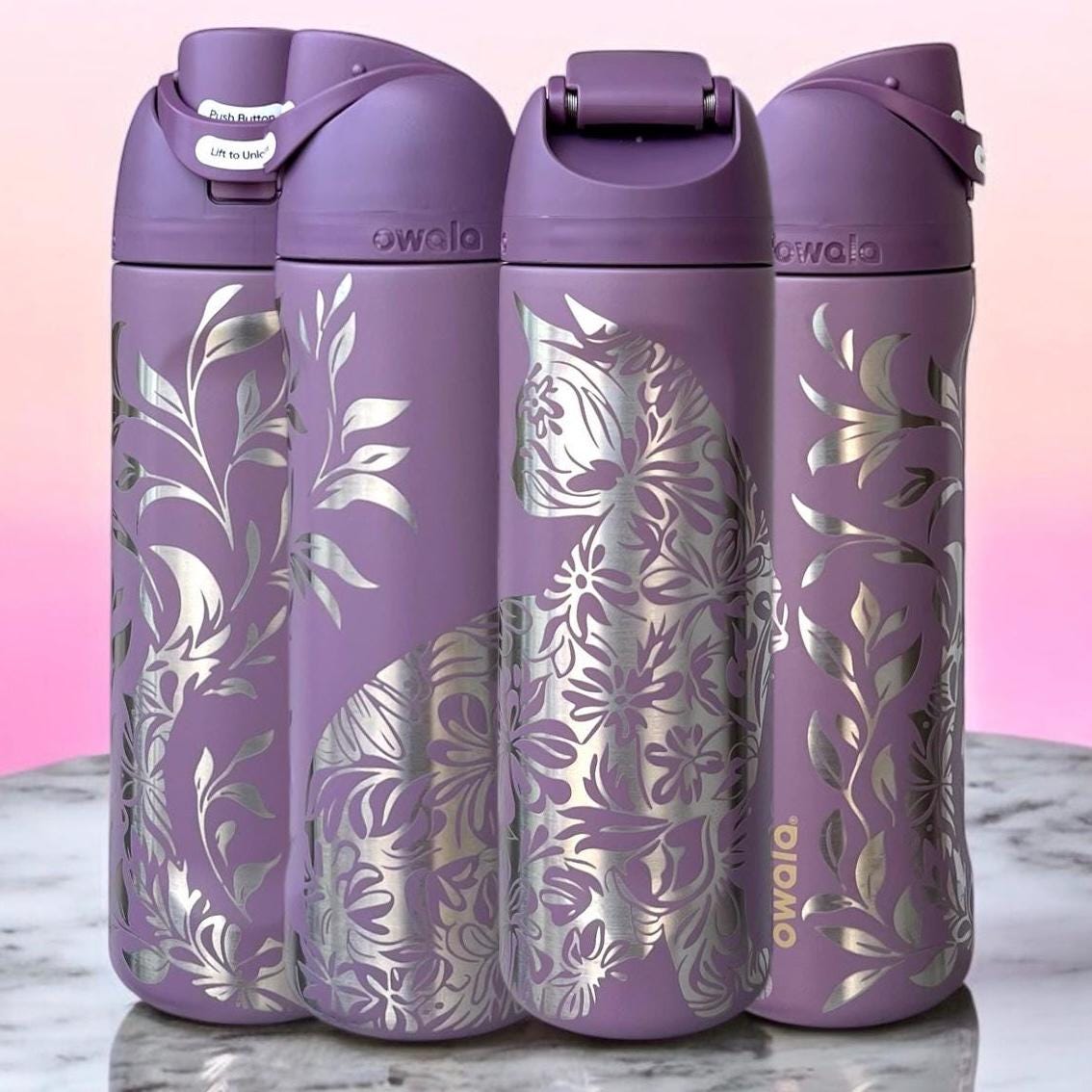 Owala Freesip 24oz water bottle with intricate full-wrap detailed floral cat engraving in spring revival color