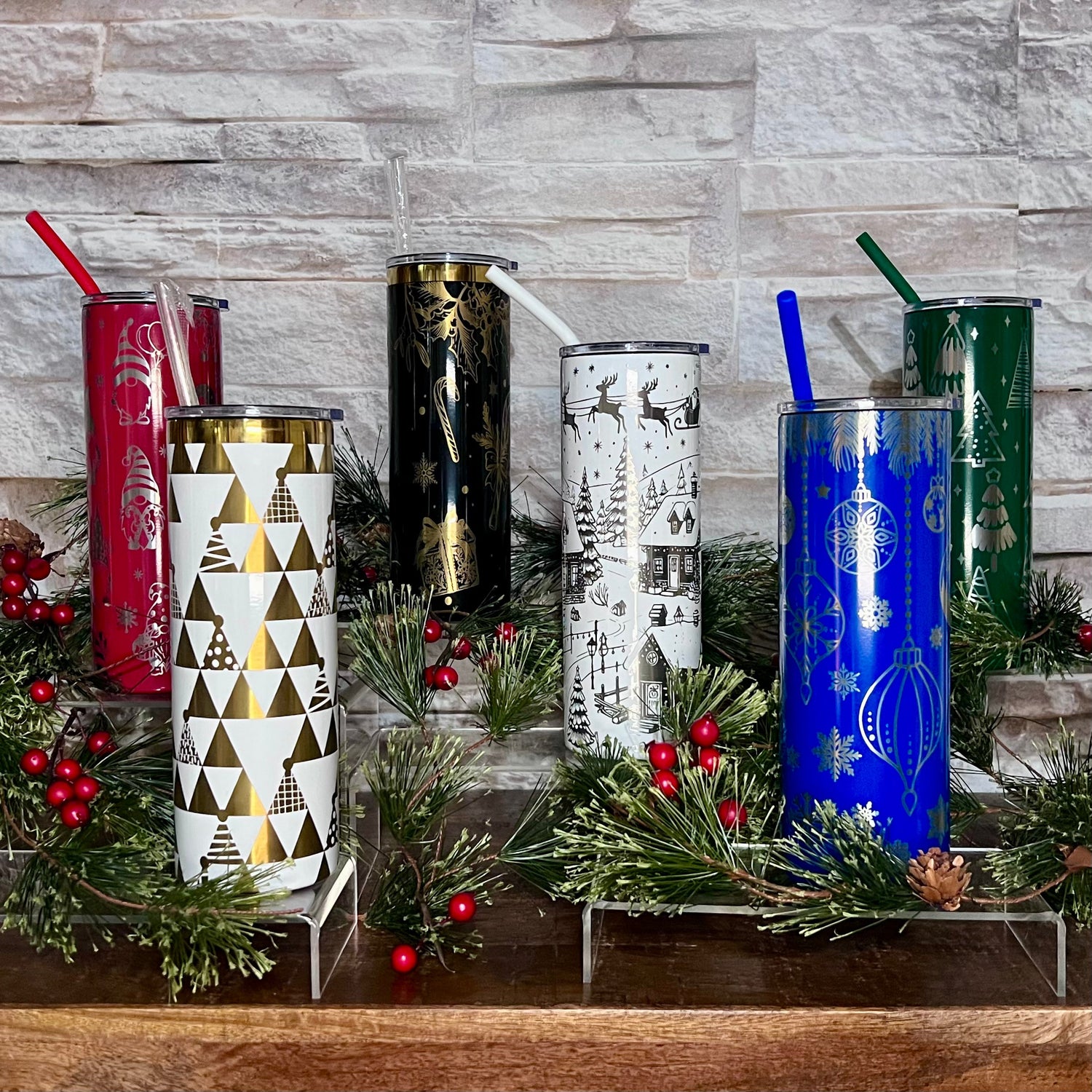 Spooky eyes on a black handle tumbler and playful ghosts on a white handle tumbler