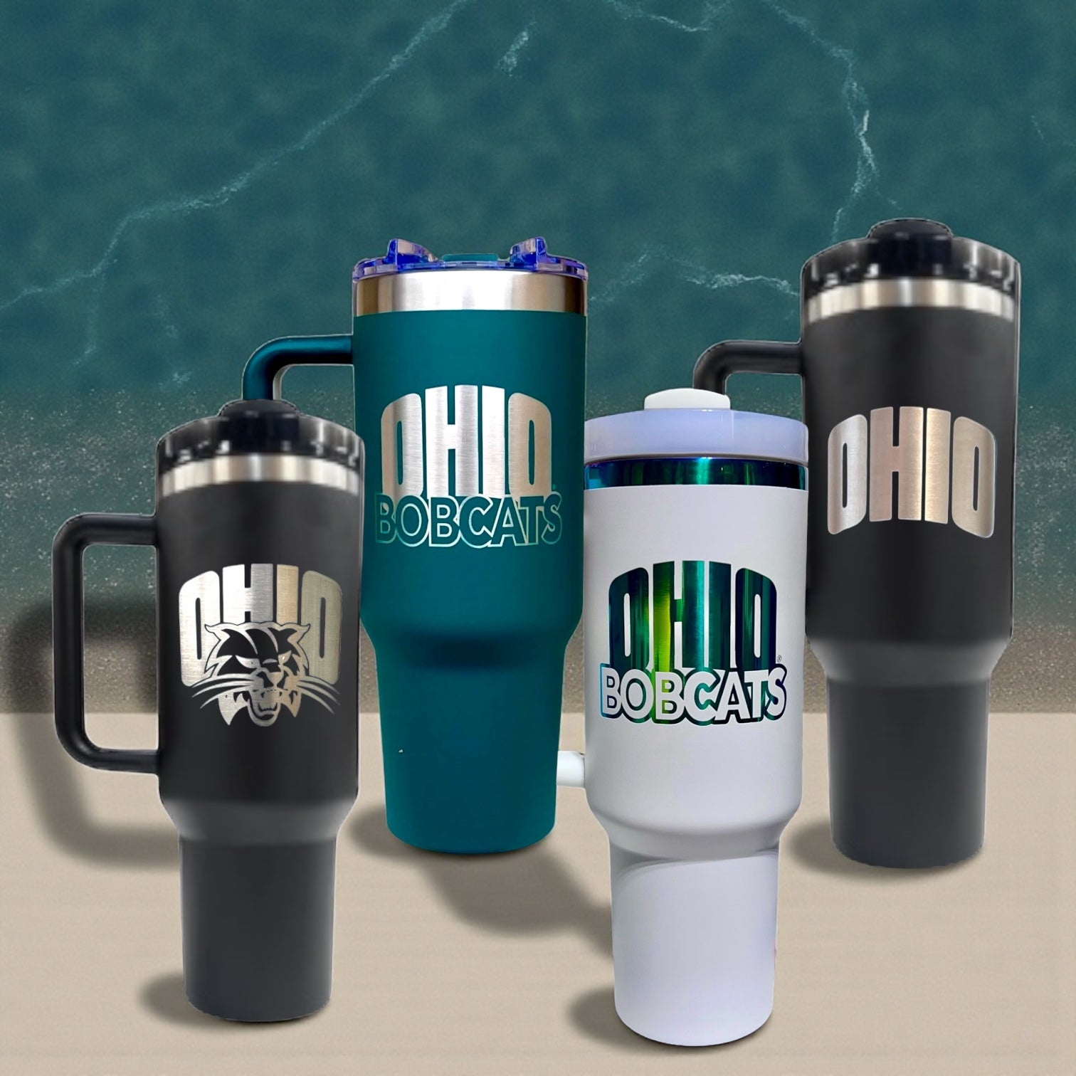 Four tumblers with 'Ohio Bobcats' branding on a textured surface and green background