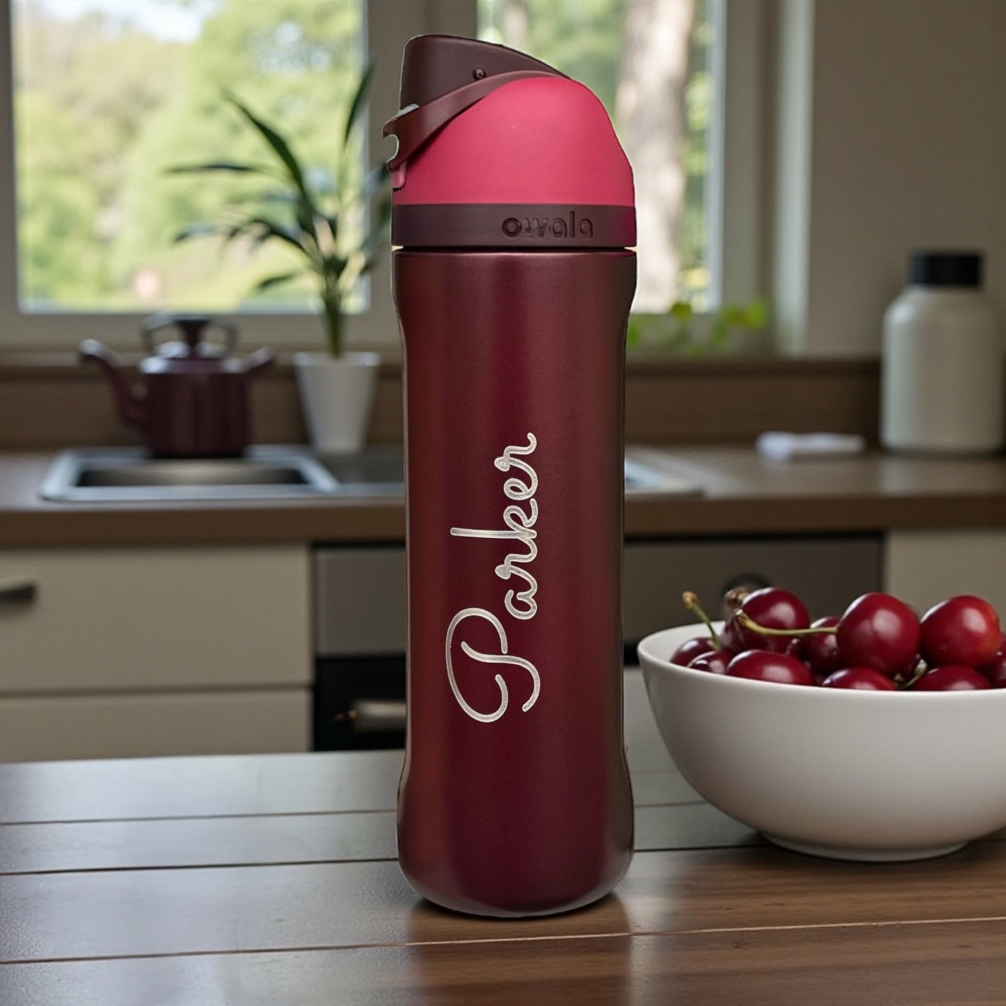 Black Cherry Owala next to bowl of cherries