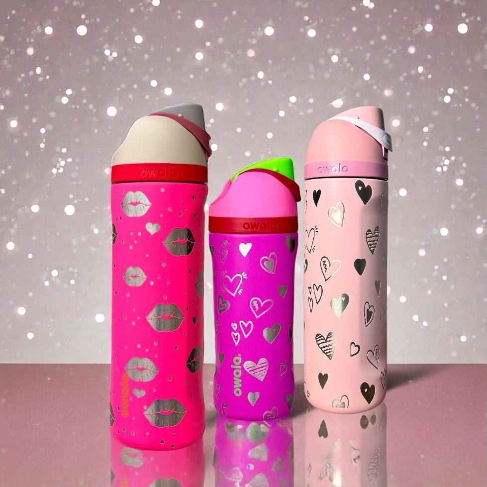 Three pink owala 24oz and Owala kids water bottles with decorative patterns on a glittery background