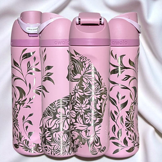 Owala Freesip 24oz water bottle with intricate full-wrap detailed floral cat engraving in rose quartz color