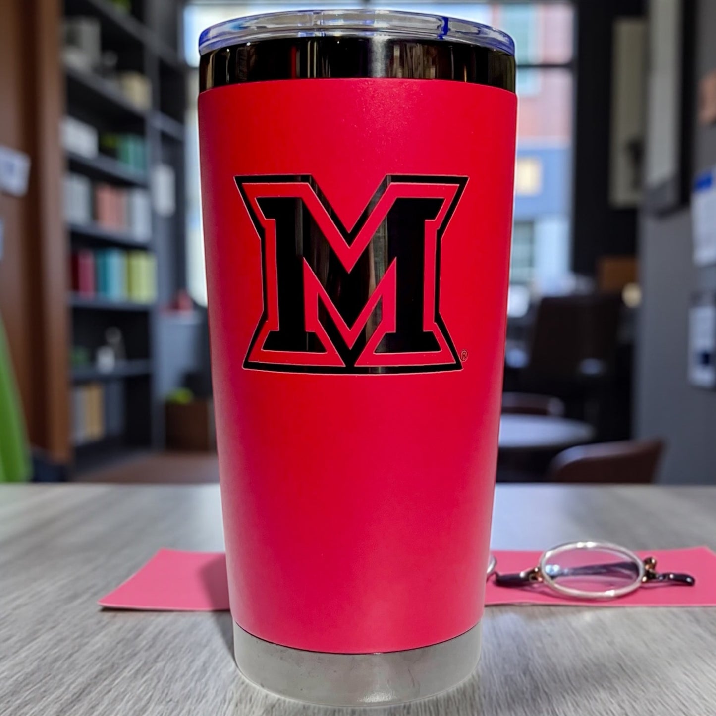 Red coffee tumbler with Black plated Miami Ohio logo engraved