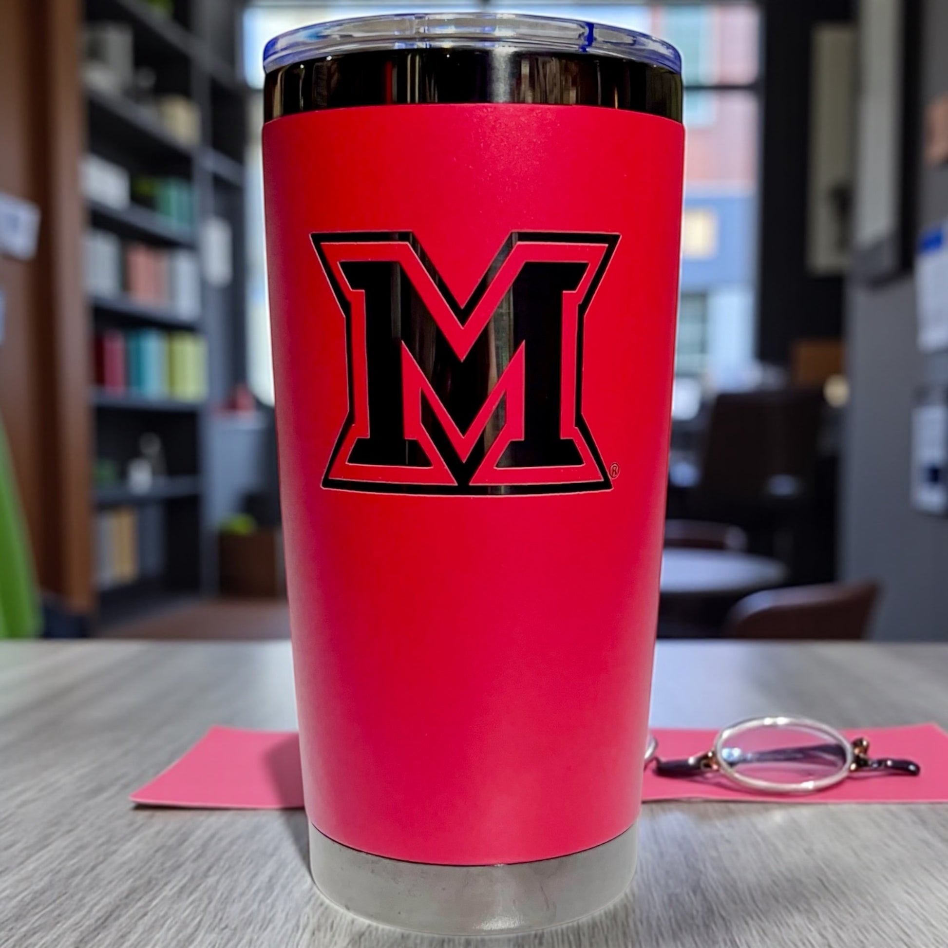 Red coffee tumbler with Black plated Miami Ohio logo engraved
