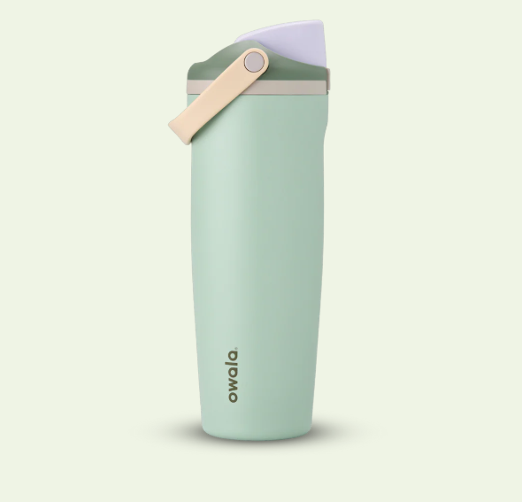 Owala Freesip Sway Eucalyptus Mint green water bottle with a pink cap on a light beige background